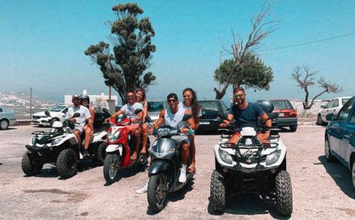 Friends on ATV Tour in Santorini group photo in Fira 